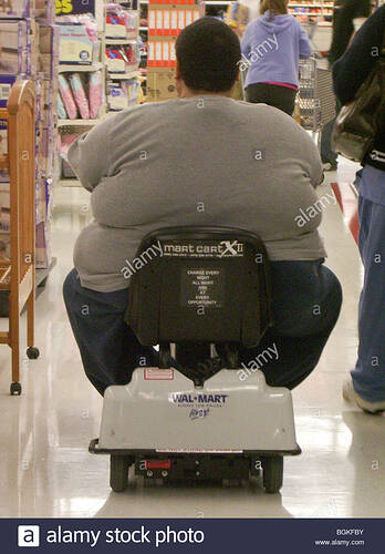 fat-man-on-electric-cart-shopping-inside-an-american-wal-mart-store-BGKFBY