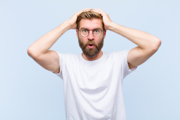 young-blonde-adult-man-feeling-horrified-shocked-raising-hands-head-panicking-mistake_1194-27115